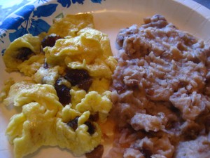 Breakfast eggs with dates and refried white beans in lard and added stock